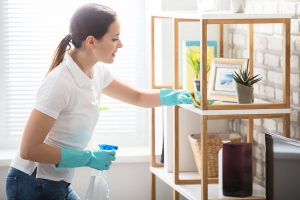 Person Cleaning Shelf - Cleanhome Sevenoaks